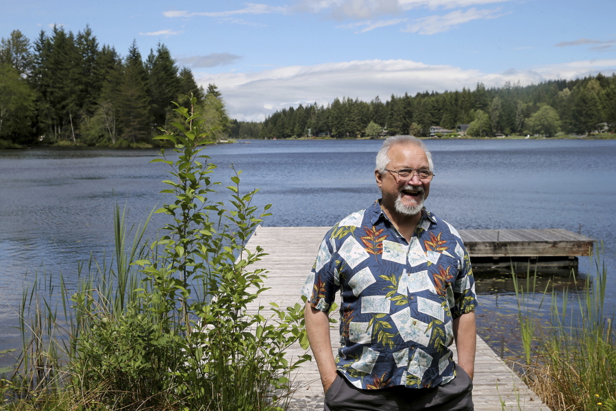 Roger Hunko, a longtime Kitsap County defense attorney and death penalty opponent, poses for a photo June 1 in his backyard on Lake Tahuya. Hunko’s expertise on death penalty trials involved him in some of the more notable and heinous Washington state cases through the past three decades.