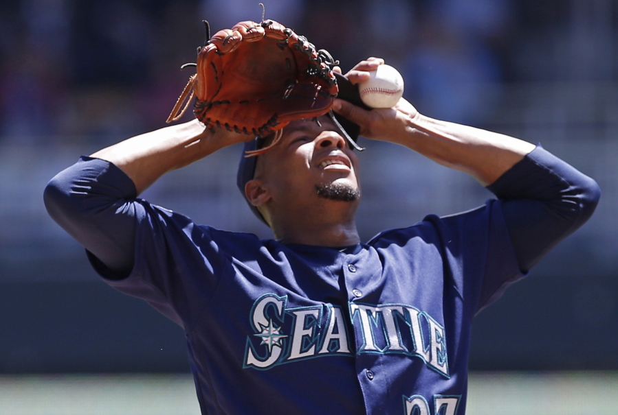 Mariners pitcher Ariel Miranda composes himself after a mound visit after he gave up a walk in the first inning. Miranda gave up five runs on two homers in the inning.