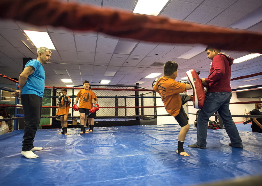 In this recent photo, youngsters work out at NorthWest Combat Fitness at the Three Rivers Mall in Kelso. Brittany Marquez is not a mixed martial arts fighter and only recently started to appreciate the sport, so she surprised even herself by opening an MMA studio.