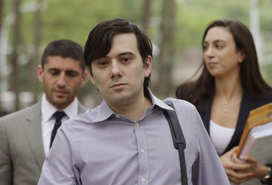Former Turing Pharmaceuticals CEO Martin Shkreli arrives at Brooklyn federal court with members of his legal team, in New York, for a pretrial conference in his securities fraud trial. Shkreli’s trial begins Monday.