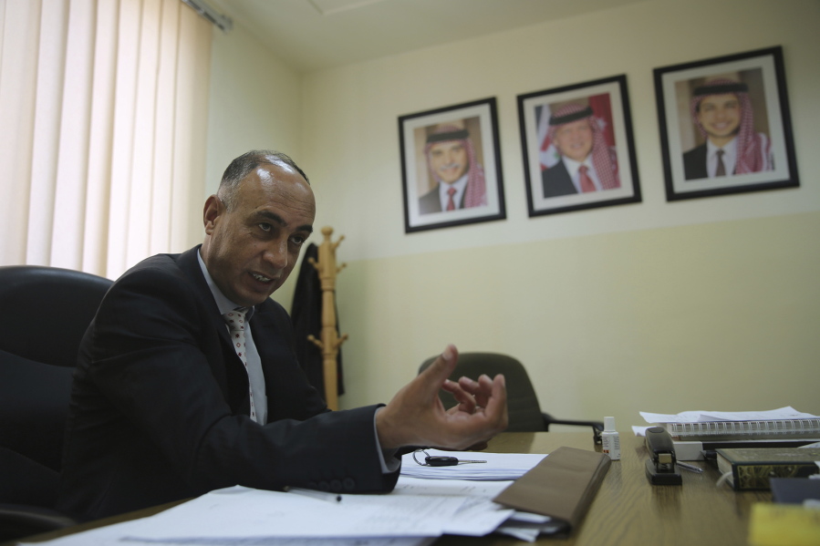 Judge Jehad al-Duradi, who deals with sexual violence cases in Jordan, speaks June 1 in an interview in his office in Amman. Jordan is on the verge of repealing an article in its penal code that allows a rapist to escape punishment if he marries his victim.