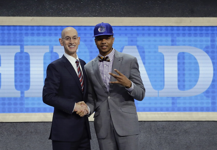 Washington’s Markelle Fultz, right, poses for a photo with NBA Commissioner Adam Silver after being selected by the Philadelphia 76ers as the No. 1 pick overall during the NBA basketball draft, Thursday, June 22, 2017, in New York.