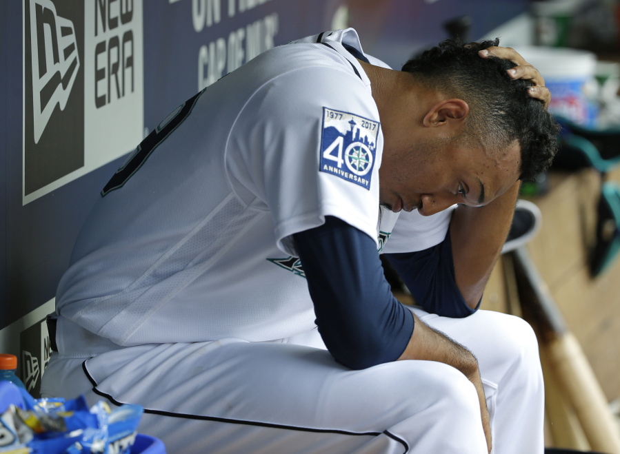 Seattle Mariners pitcher Edwin Diaz sits in the dugout after he was pulled from a baseball game against the Philadelphia Phillies in the ninth inning, Wednesday, June 28, 2017, in Seattle. Diaz was charged with the loss and a blown save as the Phillies beat the Mariners 5-4. (AP Photo/ Ted S.