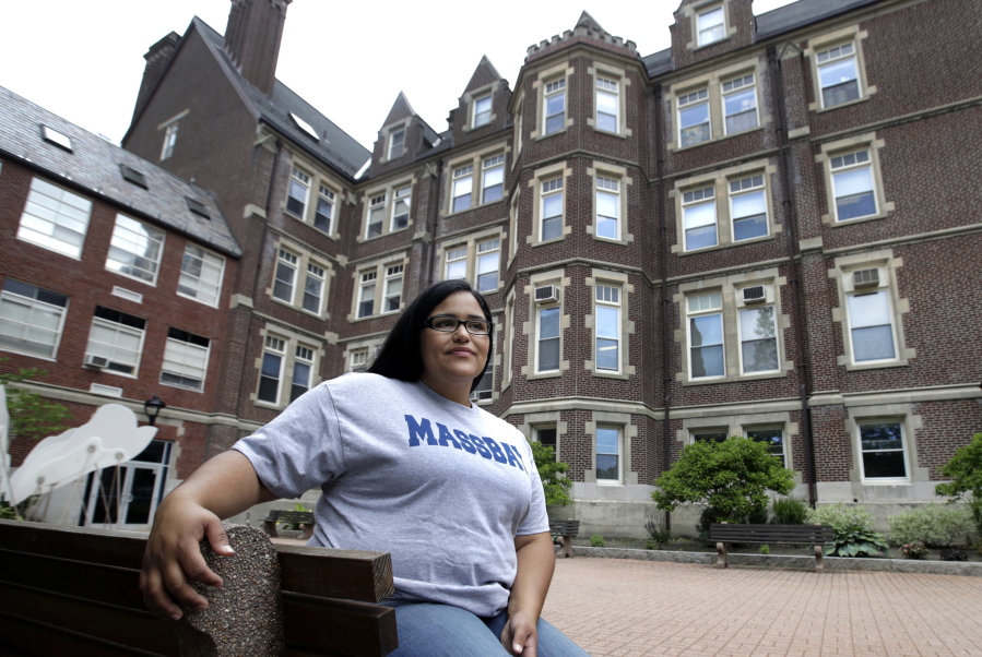 Danielle Ramos, 30, poses at MassBay Community College in Wellesley, Mass., where she pursued her education after being defrauded by a for-profit college. Thousands of students who were defrauded by for-profit colleges were told by the Obama administration that their student loans would be forgiven, but the Trump administration has yet to keep that promise.