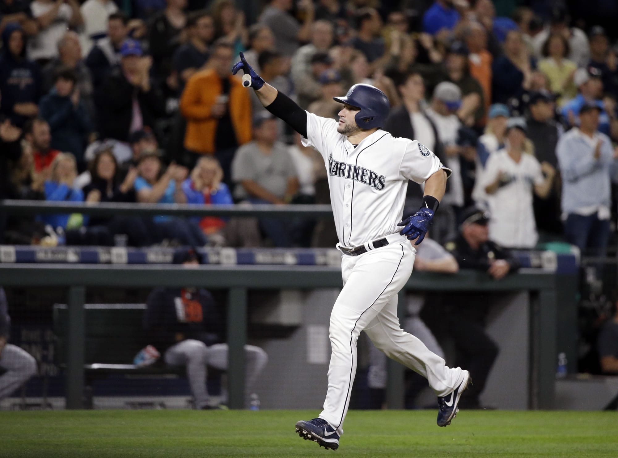 Seattle Mariners' Mike Zunino points toward the stands as he heads home on his two-run home run against the Detroit Tigers in the sixth inning of a baseball game Monday, June 19, 2017, in Seattle.