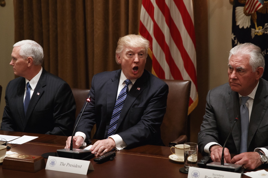 President Donald Trump, flanked by Vice President Mike Pence and Secretary of State Rex Tillerson, speaks during a meeting with South Korean President Moon Jae-in in the Cabinet Room of the White House in Washington, Friday, June 30, 2017.