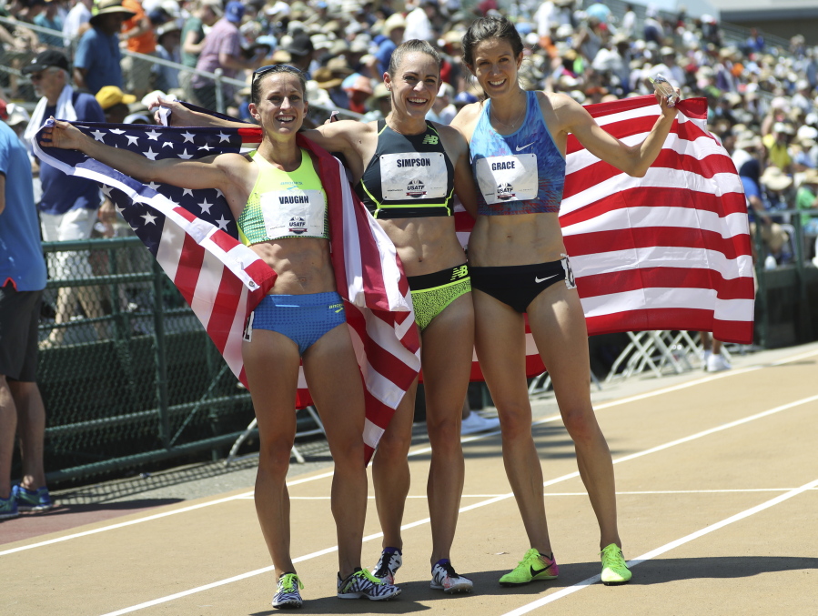 From left to right, Sara Vaughn, Jenny Simpson and Kate Grace pose with United States flags after running the women's 1500 meters at the U.S. Track and Field Championships, Saturday, June 24, 2017, in Sacramento, Calif. Simpson won the race, Grace finished second and Vaughn took third.