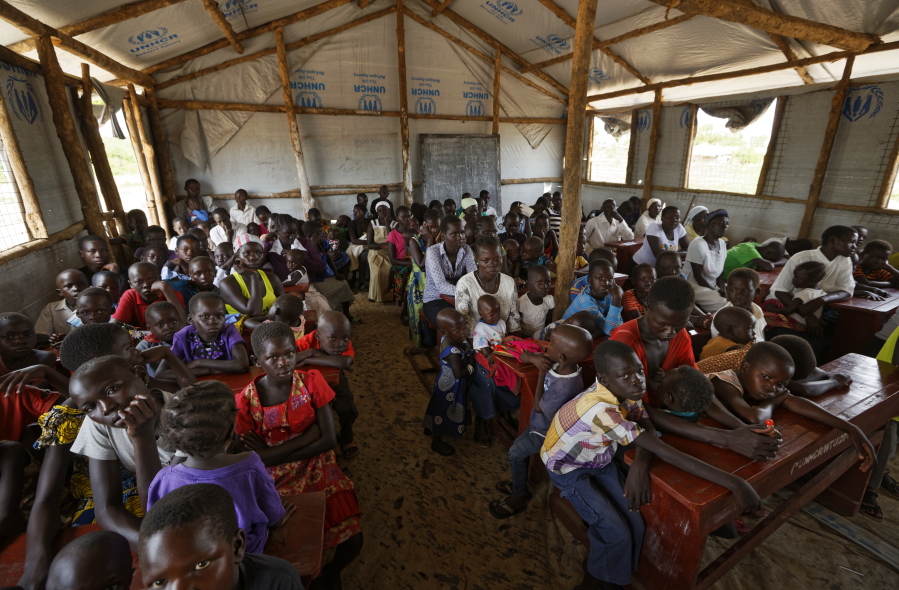 The congregation attends a Sunday service at the United Church, which is held in a school classroom tent, in Bidi Bidi refugee settlement in northern Uganda.