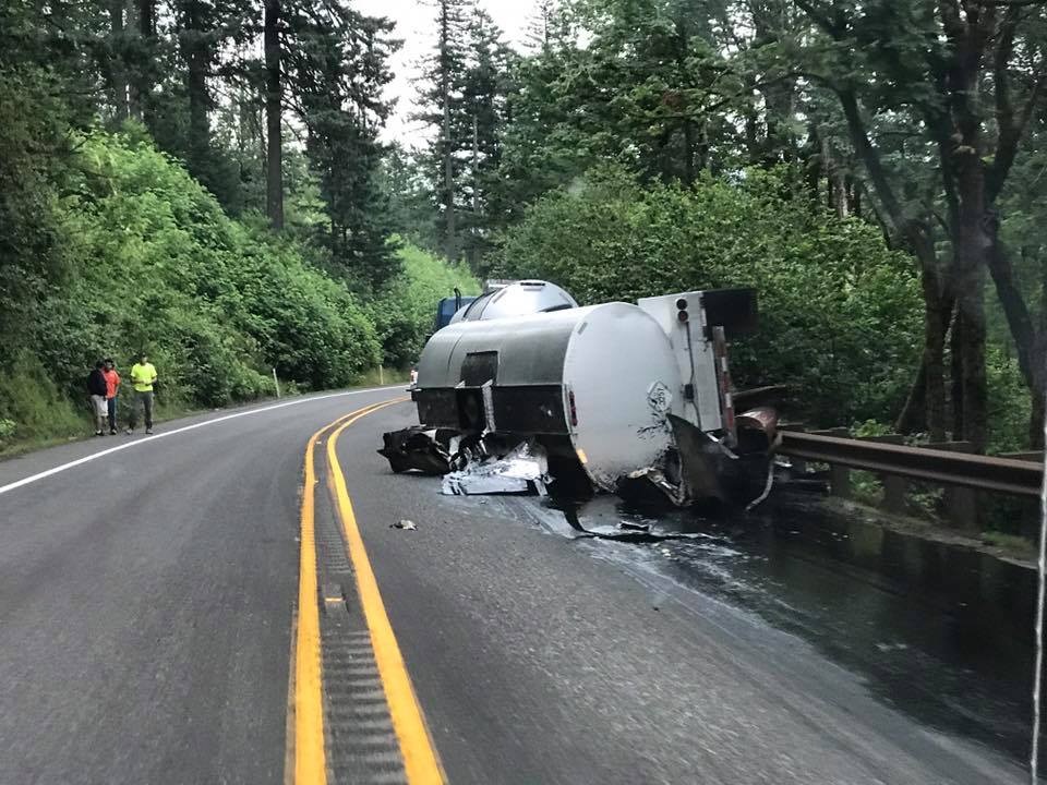 Hot oil spilled from an overturned tractor-trailer has both directions of state Highway 14 closed 8 miles east of Washougal.