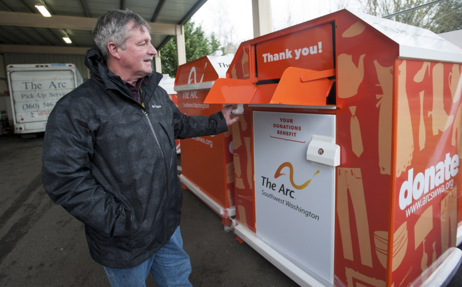 Michael Piper, then-executive director of The Arc of Southwest Washington, opens a donation bin in January 2016. The Arc has extended its relationship with Savers and may have another deal in the works to help it continue its efforts to aid people with developmental disabilities.