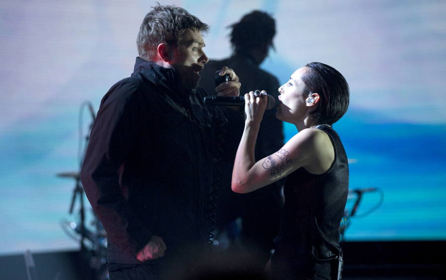 Damon Albarn and Jehnny Beth performing with Gorillaz.