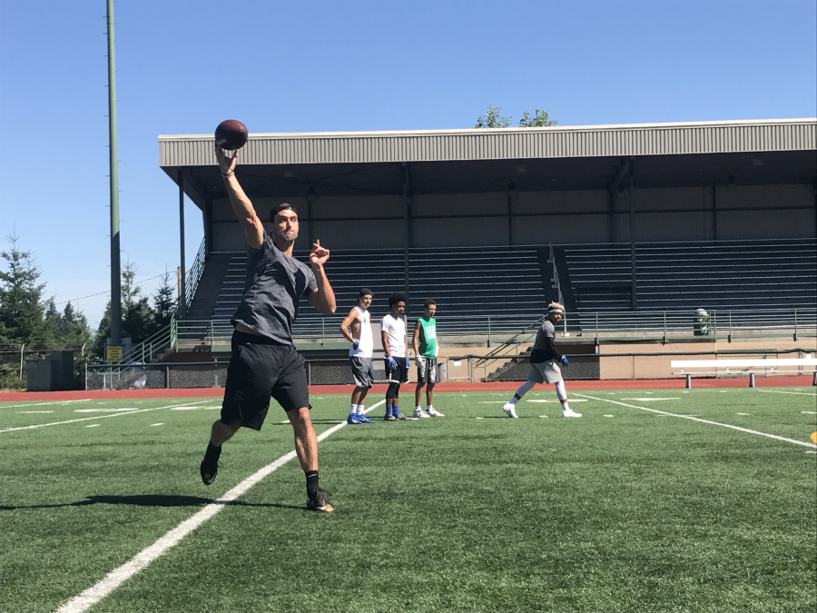 New Orleans Saints quarterback Garrett Grayson throws to Mountain View High School receivers during practice Monday at McKenzie Stadium in Vancouver. Grayson, from Vancouver, is about to enter his third NFL season.