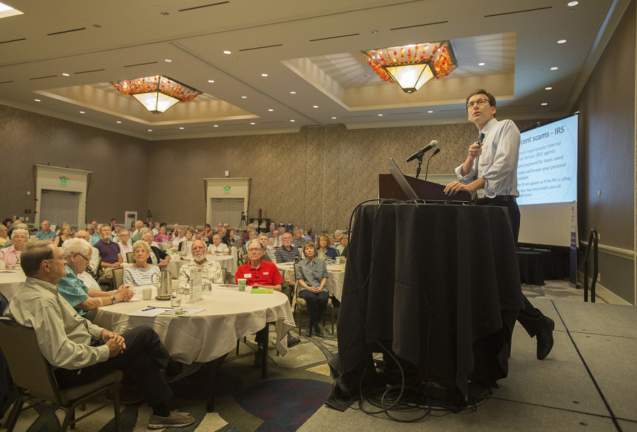 Washington Attorney General Bob Ferguson speaks to the crowd about consumer protection at Hilton Vancouver Washington on Tuesday morning. Ferguson said consumer complaints of scams have grown since he took office in 2012.