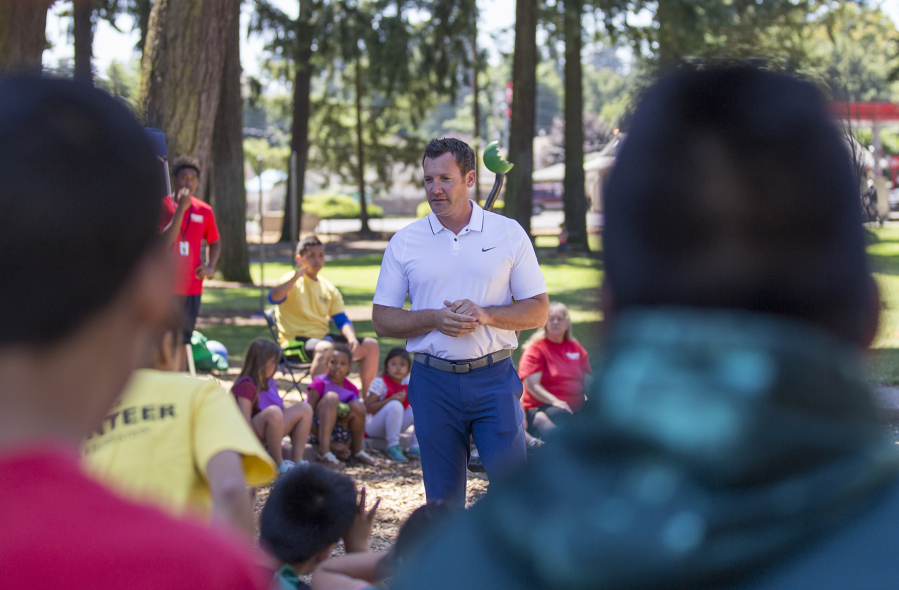 Vancouver Mayor Tim Leavitt answers kids’ questions Friday at Evergreen Park as part of the Summer Playgrounds Program in Vancouver.
