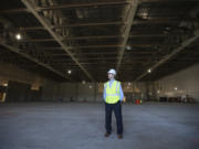 Tom Teesdale, vice president of marketing, pauses for a photo at the planned Ilani Casino Resort event center. When completed, the venue will be capable of hosting 2,500-seat concerts and conventions.
