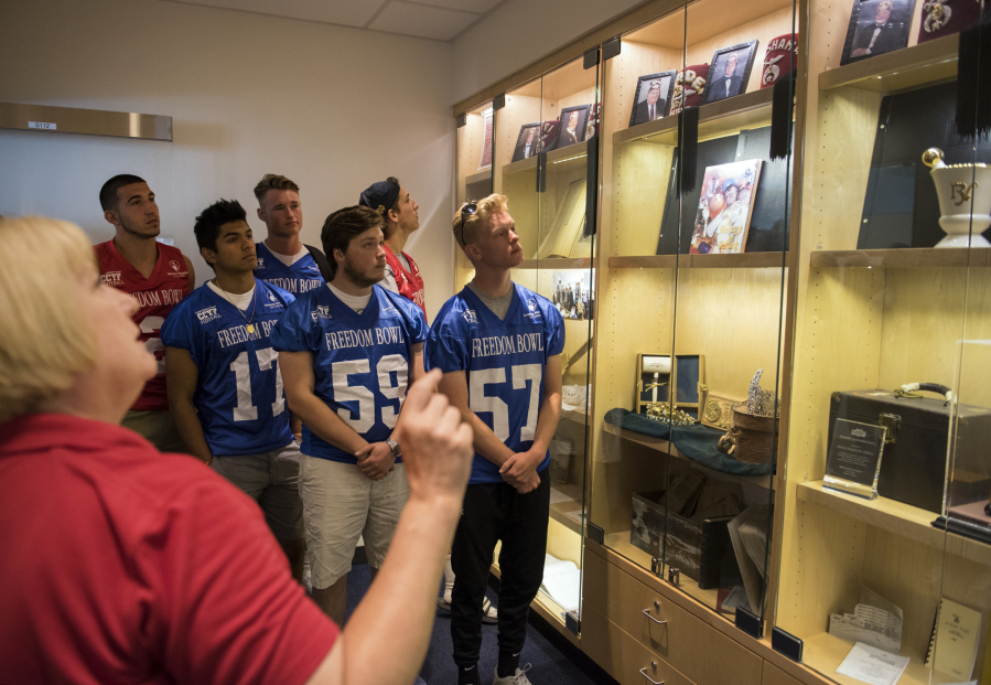 Freedom Bowl Classic football players tour the historical display room Shriners Hospital in Portland Wednesday, July 5, 2017.