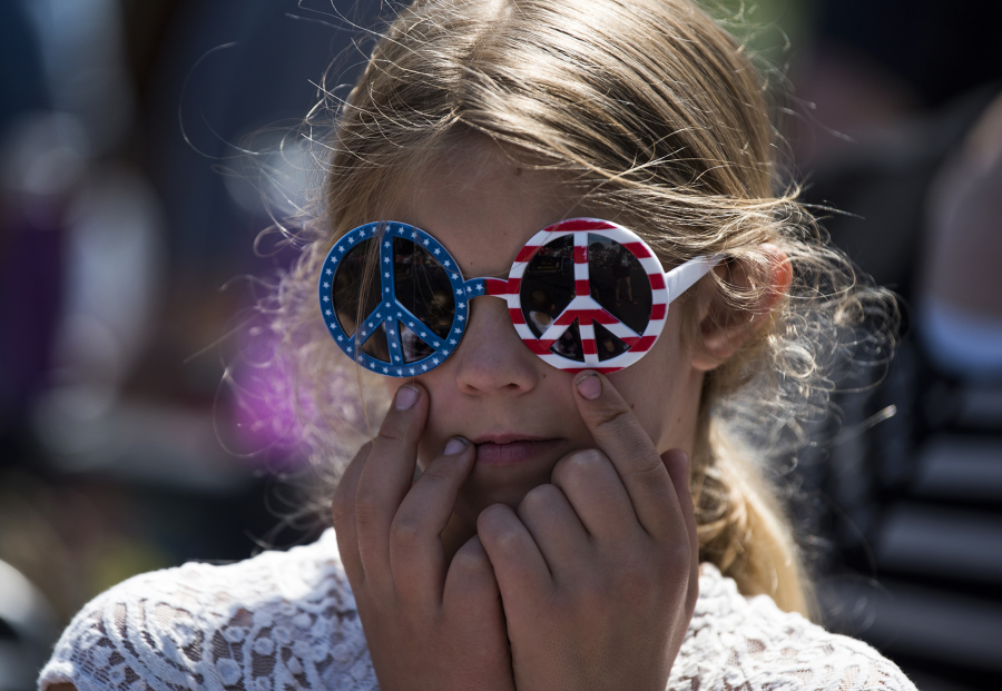 Isabella Kysar of Battle Ground, 8, sports a pair of American flag sunglasses during the Wild, Wild, West Fourth of July parade in downtown Ridgefield on Tuesday afternoon.
