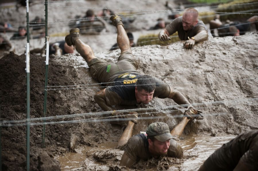 The Columbian files Thousands of participants compete in the Spartan Sprint, a 4-mile-long extreme obstacle course, held at the Washougal MX Park.