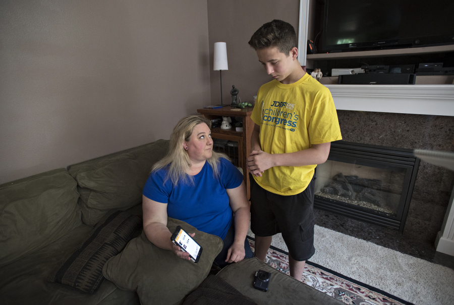 Darsi Ross of Vancouver, left, and her son, Anthony, 15, who has Type 1 diabetes, are able to monitor his blood-sugar level using an app on their phones. The Vancouver teen was among 160 kids selected to be part of the JDRF 2017 Children’s Congress in Washington, D.C.