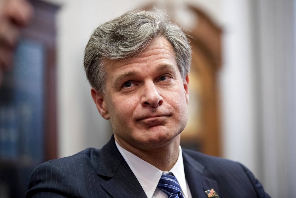 FILE - In this June 29, 2017 file photo, FBI Director nominee Christopher Wray meets with Sen. Charles Grassley, R-Iowa on Capitol Hill in Washington. Wray, nominated to replace James Comey as FBI director is described by those close to him as admirably low-key, yet he'd be taking over the law enforcement agency at a moment when its under an intense spotlight.