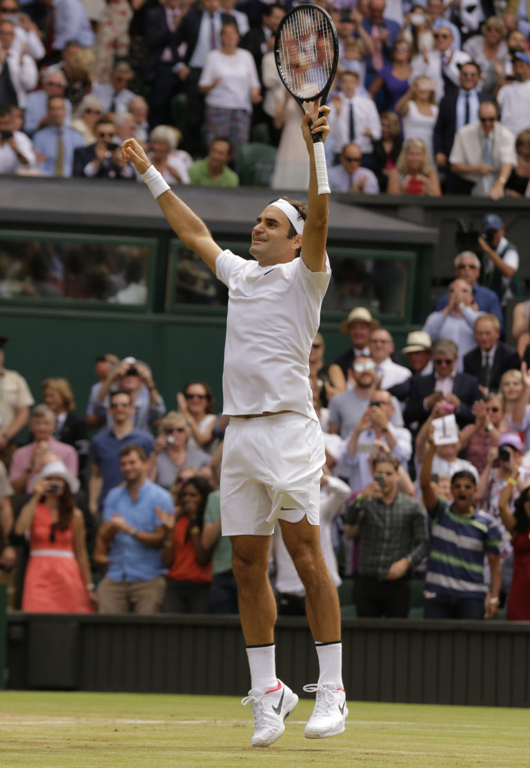 Switzerland's Roger Federer celebrates after defeating Croatia's Marin Cilic to win the Men's Singles final match on day thirteen at the Wimbledon Tennis Championships in London Sunday, July 16, 2017.