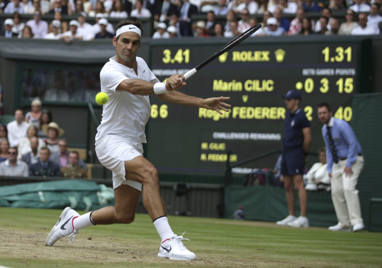 Switzerland's Roger Federer returns to Croatia's Marin Cilic during the Men's Singles final match on day thirteen at the Wimbledon Tennis Championships in London Sunday, July 16, 2017.