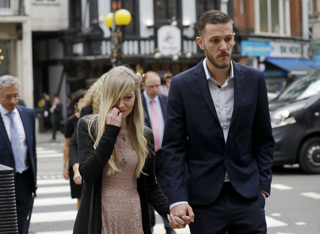 The parents of critically ill baby Charlie Gard, Connie Yates and Chris Gard, arrive at the High Court in London, Monday, July 24, 2017. The parents of the 11-month old, who has a rare genetic condition and brain damage, are returning to court for the latest stage in their effort to seek permission to take the child to the United States for medical treatment.
