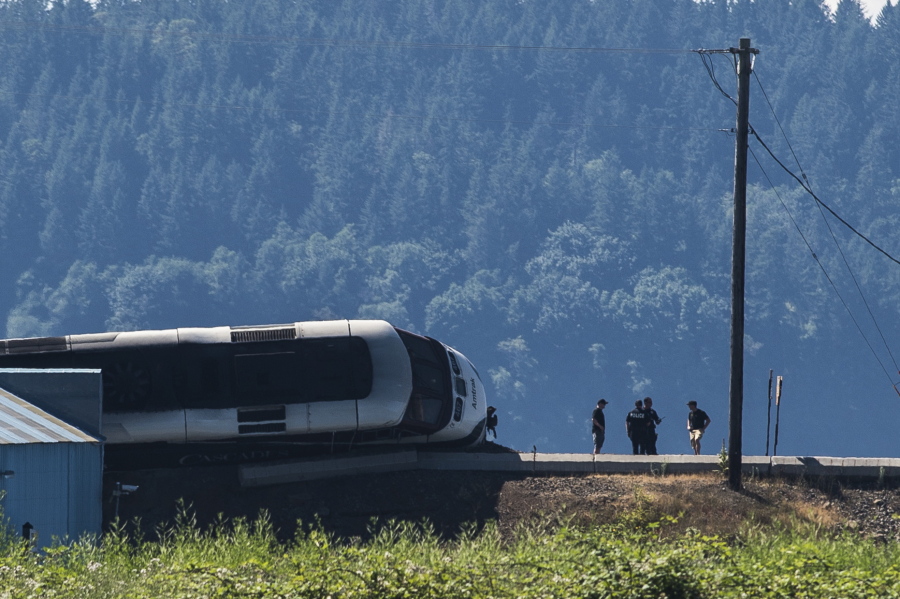 Emergency crews respond to the scene of a train derailment near Chambers Bay on Sunday, July 2, 2017, in Tacoma, Wash. There appear to be only minor injuries from the waterfront derailment of the Amtrak Cascades train near the town of Steilacoom, the Pierce County Sheriff’s Office said on Twitter. The train runs between Vancouver, Canada, and Eugene-Springfield, Oregon.