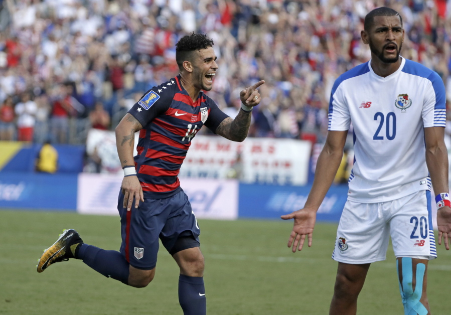 United States’ Dom Dwyer (14) celebrates after scoring a goal as Panama’s Anibal Godoy (20) protests.