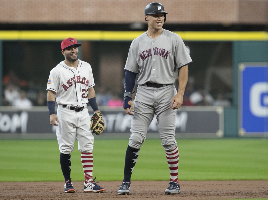 New York Yankees’ Aaron Judge, right, and Houston Astros second baseman Jose Altuve have a conversation during the first inning of a baseball game, Sunday, July 2, 2017, in Houston. Both players have been elected to start in the All-Star Game in Miami on July 12, 2017.