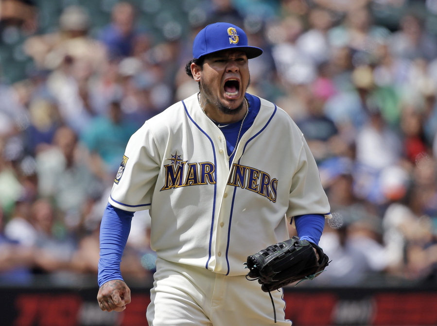 Seattle Mariners starting pitcher Felix Hernandez turns and lets out a yell after striking out Oakland Athletics’ Jed Lowrie to end the top of the sixth inning of a baseball game, Sunday, July 9, 2017, in Seattle.