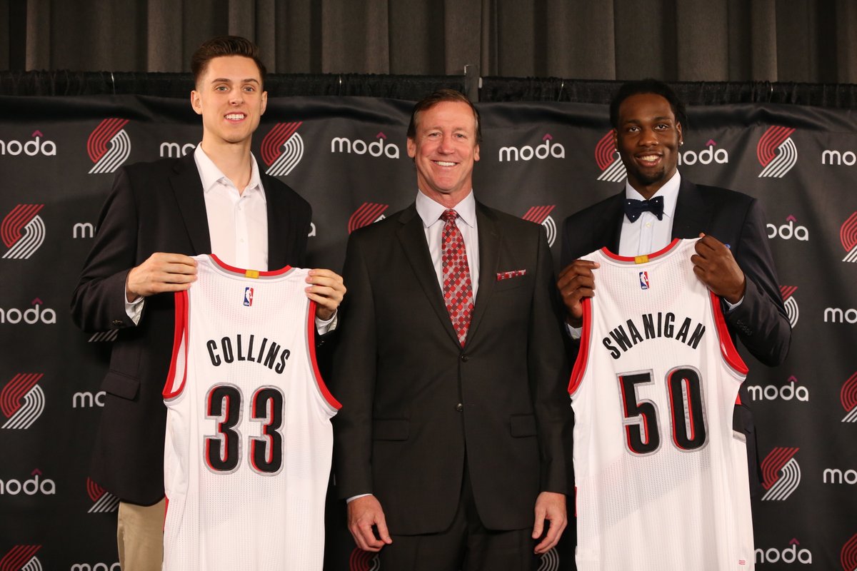 New members of the Portland Trail Blazers Zach Collins and Caleb Swanigan with head coach Terry Stotts.