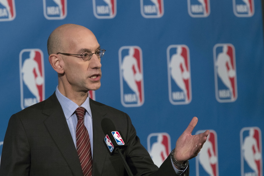 FILE - In this Oct. 21, 2016, file photo, NBA Commissioner Adam Silver speaks to reporters during a news conference, in New York. The NBA is trying to make games go a little more quickly. The league's Board of Governors has unanimously approved some changes that will potentially eliminate four time-outs per game, help speed up the final minutes of games and emphasize a timely resumption of play after halftime.