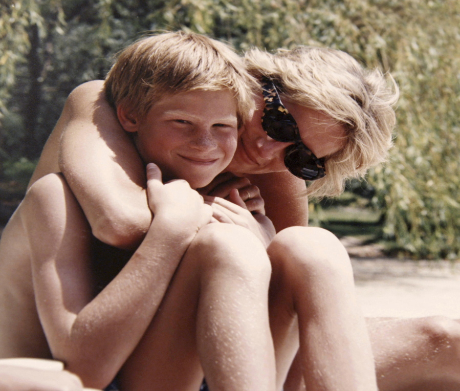 In this photo made available by Kensington Palace from the personal photo album of the late Diana, Princess of Wales, shows the princess and Prince Harry on holiday, and features in the new ITV documentary “Diana, Our Mother: Her Life and Legacy.” (The Duke of Cambridge and Prince Harry/Kensington Palace via AP)