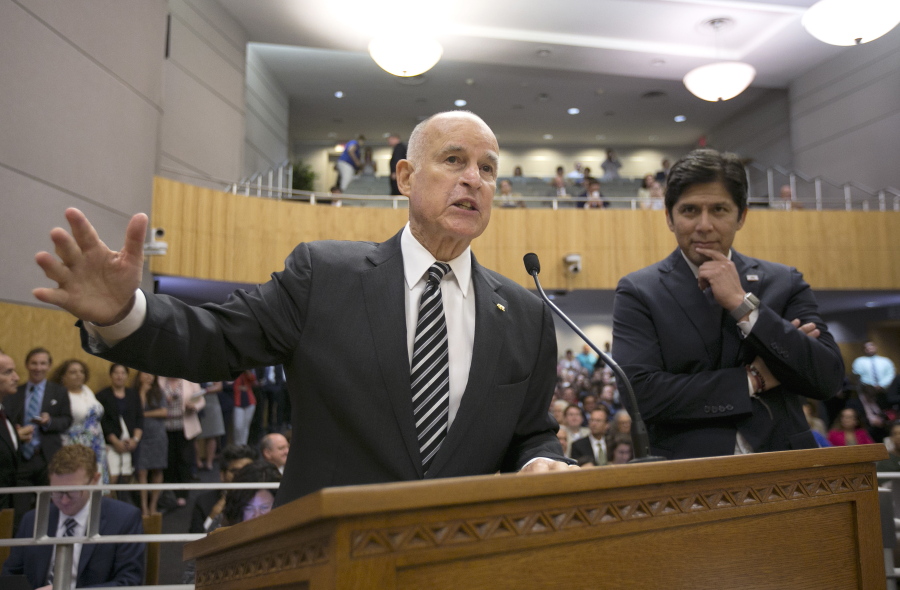 Calif., Gov. Jerry Brown, left, testifies July 13 in support of a pair of climate change bills as Senate President Pro Tem Kevin de Leon, D-Los Angeles, looks on during a hearing of the Senate Environmental Quality Committee, in Sacramento, Calif. California lawmakers are nearing a high-stakes decision that will decide the fate of a climate initiative that Brown holds up as a model to be replicated around the world to confront rising global temperatures. A vote is set for Monday on whether to give another decade of life to California’s cap-and-trade program.