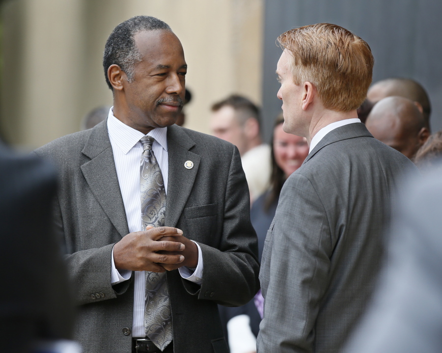 Housing and Urban Development Secretary Ben Carson, left, talks April 19 with Sen. James Lankford, R-Okla. in Oklahoma City, Oklahoma. Carson is pledging to “work toward a time when no family is without a home,” even as the Trump administration seeks sharp budget cuts that critics say would lead to more people living on the streets.