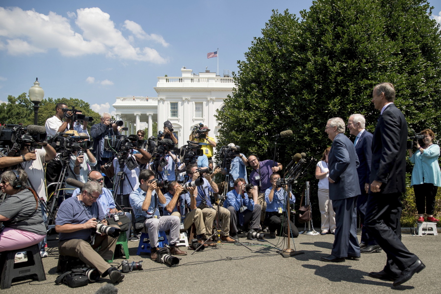 From left, Senate Majority Leader Mitch McConnell of Ky., Senate Majority Whip John Cornyn of Texas., and Sen. John Thune, R-S.D., speaks to members of the media outside of the West Wing of the White House in Washington, on Wednesday, following a luncheon with President Donald Trump and other GOP leadership.