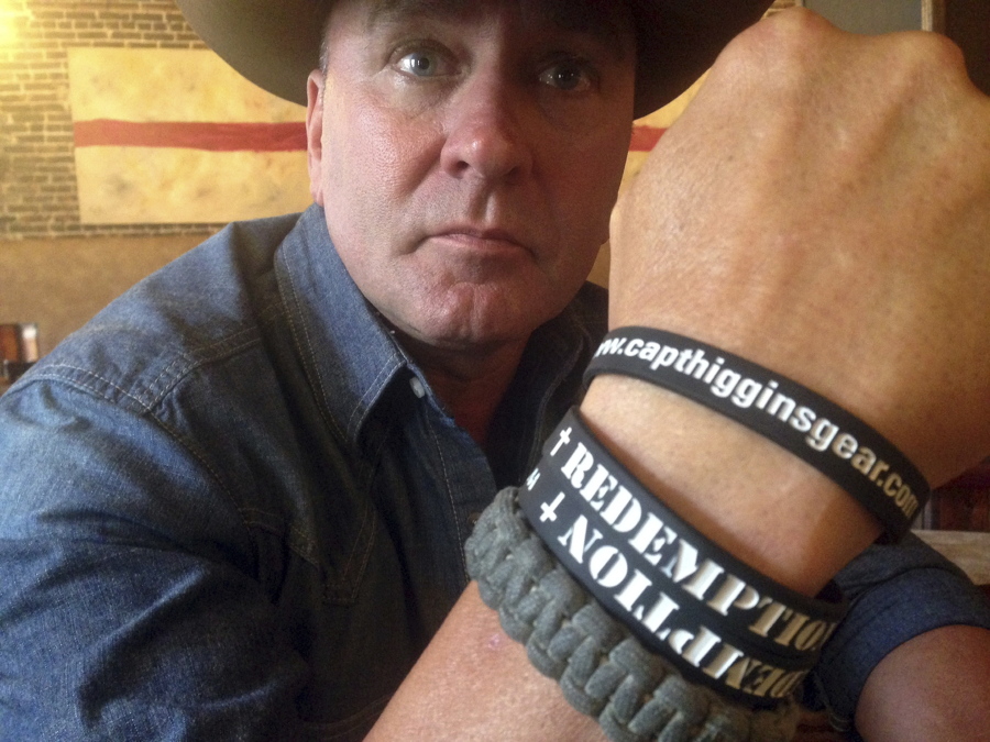 Clay Higgins, a former Captain for the St. Landry Parish Sheriff’s office, and candidate for Congress, poses for a photograph in Lafayette, La. The Louisiana congressman is apologizing for the “unintended pain” caused by a video of his visit to a gas chamber at a Nazi concentration camp. Higgins said in an email Wednesday that he’s retracting the video, recorded at the Auschwitz camp in Poland that is now part of the Auschwitz-Birkenau Memorial and Museum.
