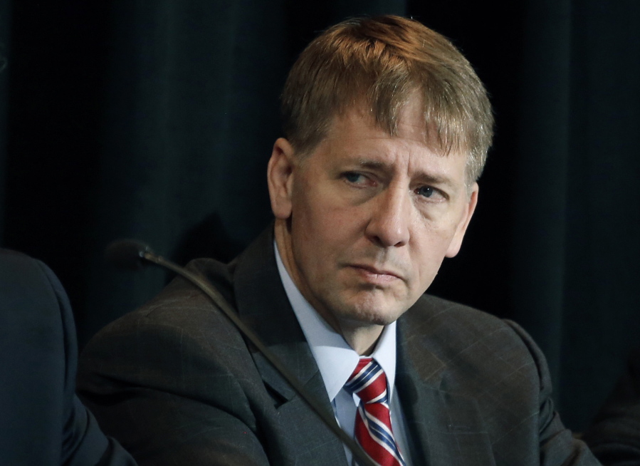 Consumer Financial Protection Bureau Director Richard Cordray listens to a speaker during a hearing in Denver in 2015.
