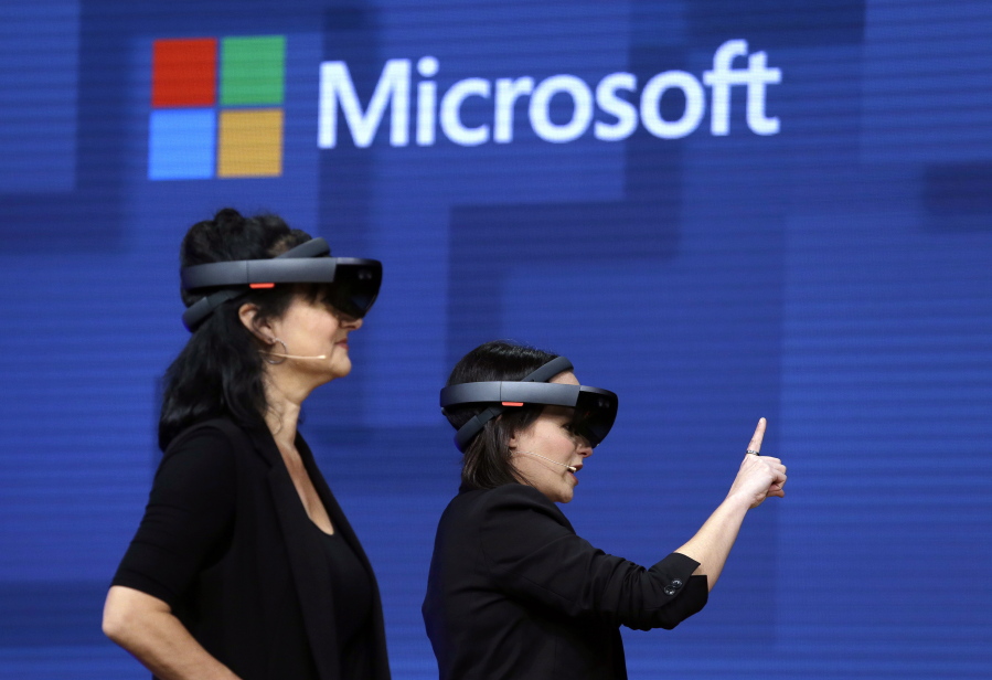 Members of a design team at Cirque du Soleil demonstrate use of Microsoft’s HoloLens device in helping to virtually design a set at the Microsoft Build 2017 developers conference May 11 in Seattle.
