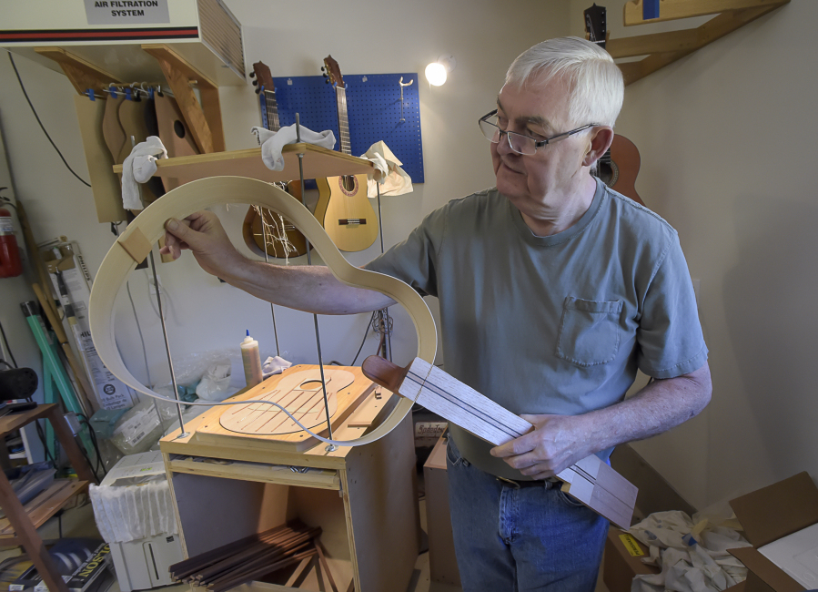 A guitar takes shape at Shelton-Farretta Guitars in Alsea, Ore.. John Shelton and Susan Farretta have been building guitars together for 40 years.