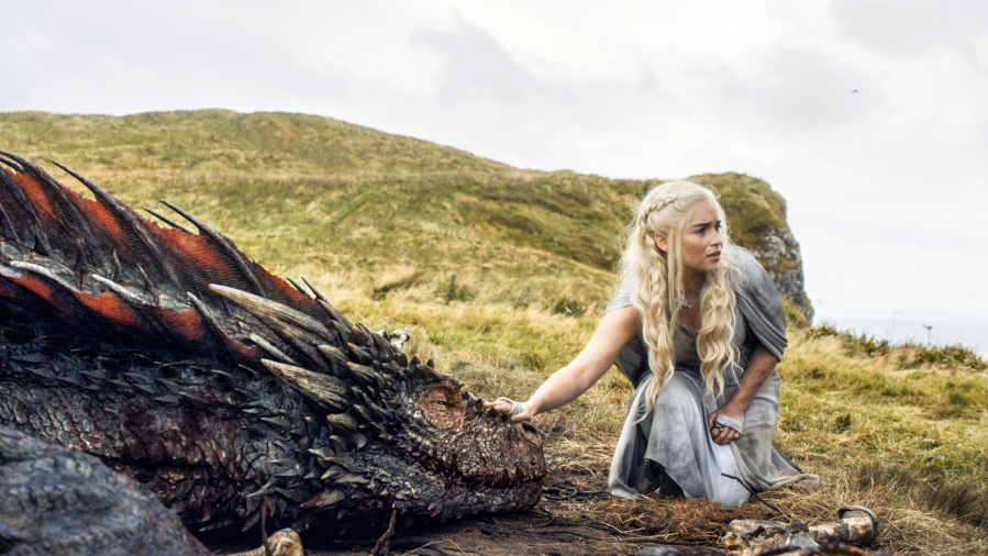Emilia Clarke appears in a scene from “Game of Thrones” as the menacing, white-haired Daenerys Targaryen, aka Khaleesi, aka “Mother of Dragons.” Even in a world with magic, dragons and deadly supernatural White Walkers, HBO’s popular show has plenty of economic lessons to teach.