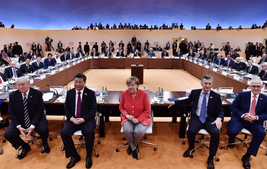 From left: US President Donald Trump, China’s President Xi Jinping, German Chancellor Angela Merkel, Argentina’s President Mauricio Macri and Australia’s Prime Minister Malcolm Turnbull turn around for photographers at the start of the first working session of the G20 meeting in Hamburg, northern Germany, on Friday.