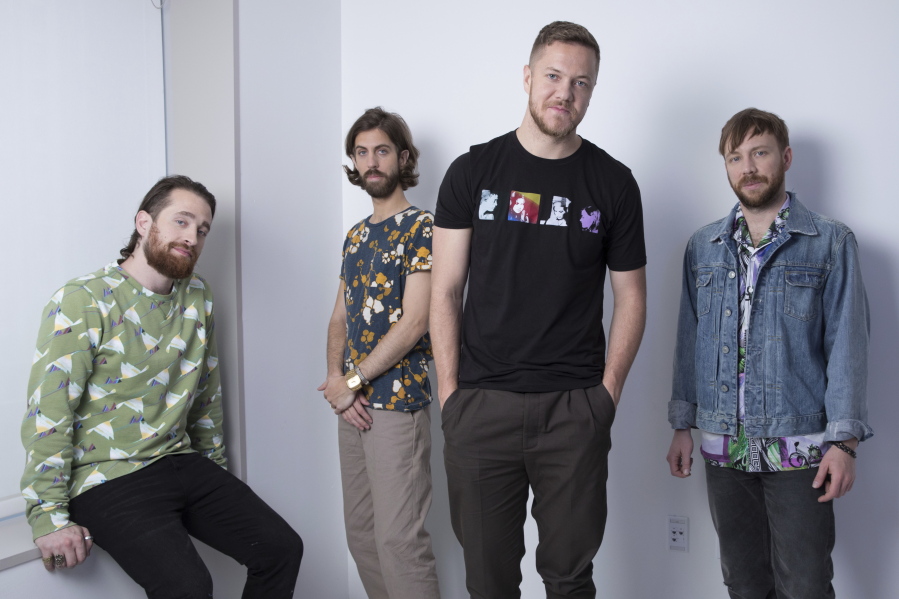 This June 20, 2017 photo shows members of imagine Dragons, from left, Brittany Tolman, Wayne Sermon, Dan Reynolds and Ben McKee in New York.