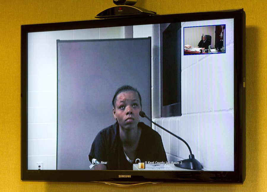 Lovily Kristine-Anwonette Johnson appears on a video monitor for her arraignment at Wyoming District Court on Monday in Wyoming, Mich. Court records say Johnson was charged with first-degree murder and first-degree child abuse in the death of 6-month-old Noah Johnson.