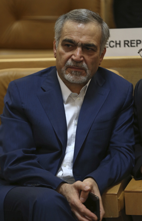 Hossein Fereidoun, brother and top aide of moderate Iranian President Hassan Rouhani sits in a conference in Tehran, Iran.