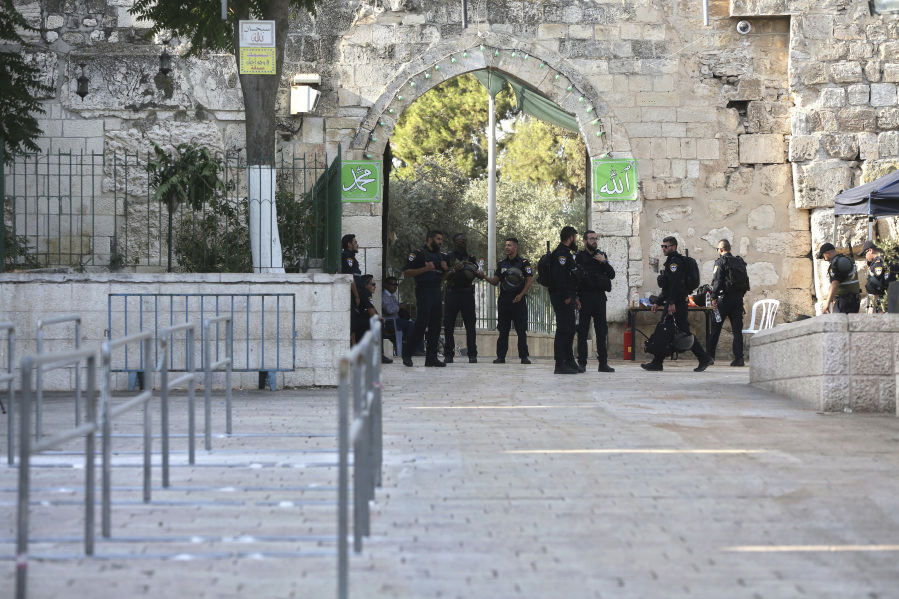 Israeli police officers stand outside the Al Aqsa Mosque compound in Jerusalem’s Old City on Tuesday. Israel has begun dismantling metal detectors it installed a week earlier at the gates of a contested Jerusalem shrine, amid widespread Muslim protests.