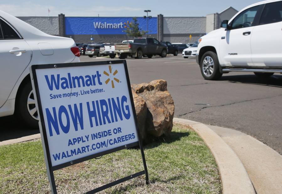 This Tuesday, May 30, 2017, photo shows a sign in the parking lot of a Walmart announcing that the store is hiring, in Oklahoma City. On Tuesday, July 11, 2017, the Labor Department reports on job openings and labor turnover for May.