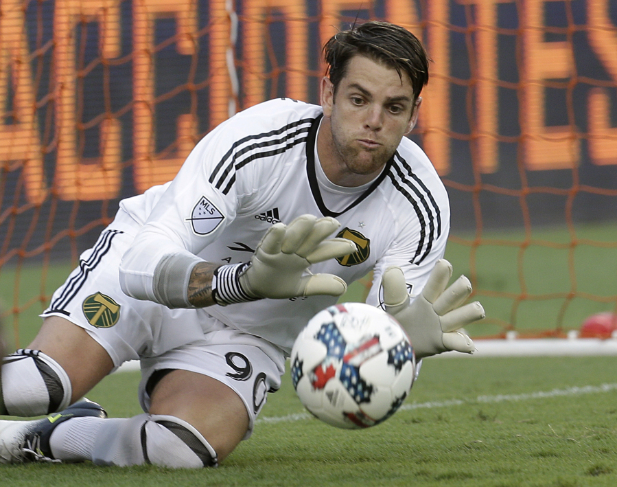 Portland Timbers goalkeeper Jake Gleeson makes a save against the Houston Dynamo in the first half of an MLS soccer game in Houston, Saturday, July 29, 2017. (Thomas B.