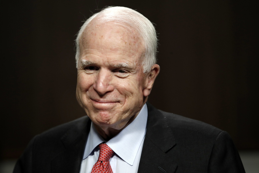 FILE - In this July 11, 2017, file photo, Sen. John McCain, R-Ariz., arrives on Capitol Hill in Washington. McCain has been diagnosed with a brain tumor after a blood clot was removed.